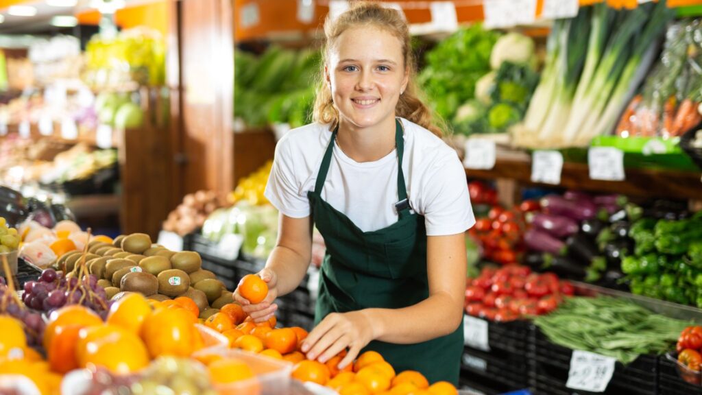 Young woman working at a grocery store
