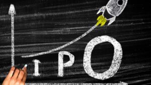 Photo of a rocket ship on a graph going up to represent SpaceX IPO